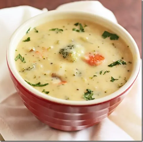 red bowl with broccoli cheese soup