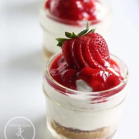 Gluten free strawberry cheesecake in individual serving jars.