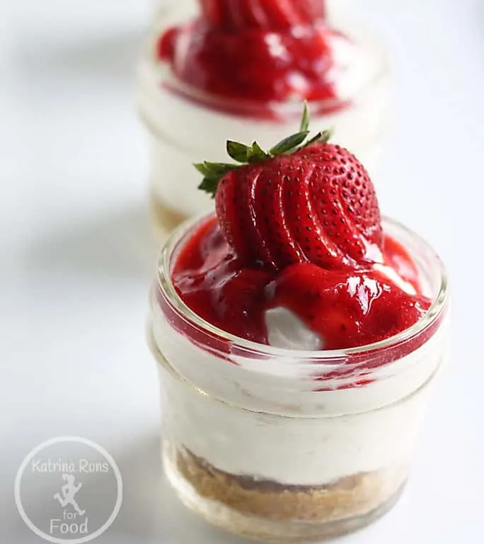 Gluten free strawberry cheesecake in individual serving jars.