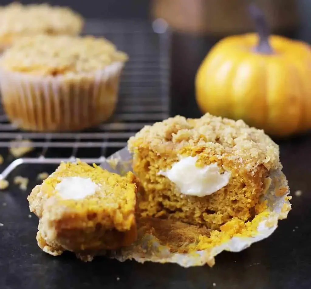 Gluten Free Pumpkin Cream cheese muffin cut in half